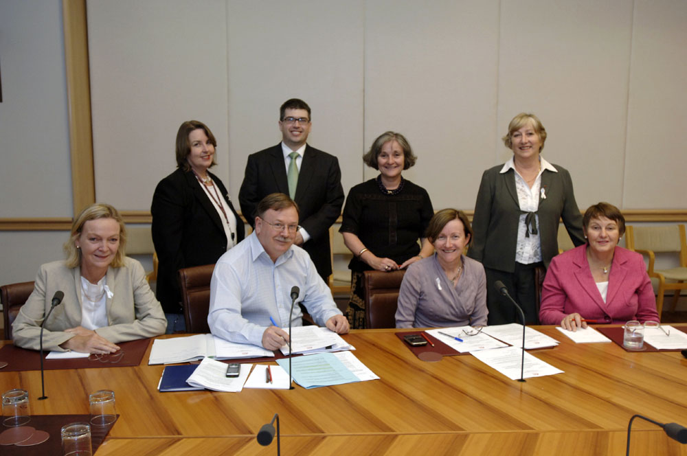 The Community Affairs References Committee, 25 November 2009. Standing L-R: Christine McDonald [Principal Research Offficer], Owen Griffiths [Senior Research Officer], Senators Claire Moore [Deputy Chair] and Sue Boyce. Seated L-R: Senator Jan McLucas, Elton Humpherey [Secretary], Senators Rachel Siewert [Chair] and Judith Adams. DPS Auspic.