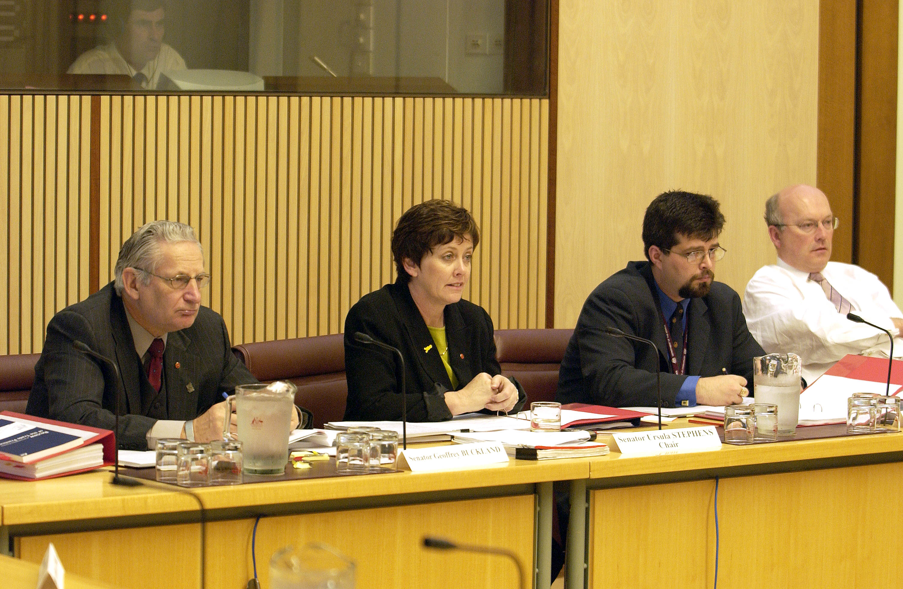 Economics References Committee in session, 17 October 2003. L-R: Senators Geoff Buckland and Ursula Stephens [Chair], Dr Anthony Marinac [Acting Secretary] and Senator George Brandis [Deputy Chair]. DPS Auspic.