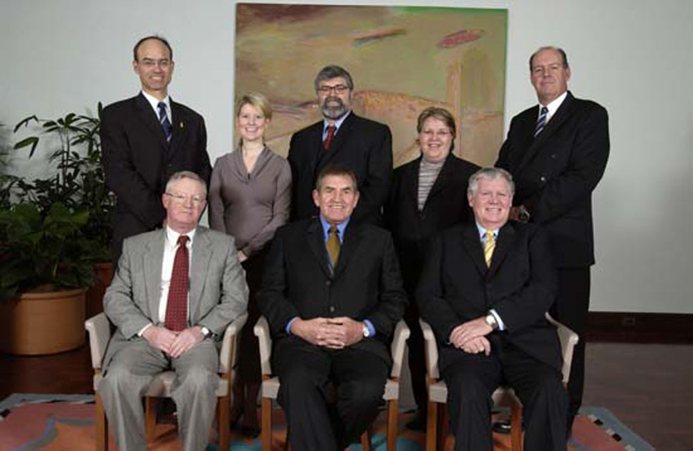 Standing Committees on Employment, Workplace Relations and Education (Legislation and References), 11 August 2004. Standing L-R: Senators Guy Barnett, Natasha Stott Despoja, Kim Carr, Trish Crossin and David Johnston. Seated L-R: John Carter [Secretary], Senators George Campbell [Chair, References] and John Tierney [Deputy Chair, References]. DPS Auspic.