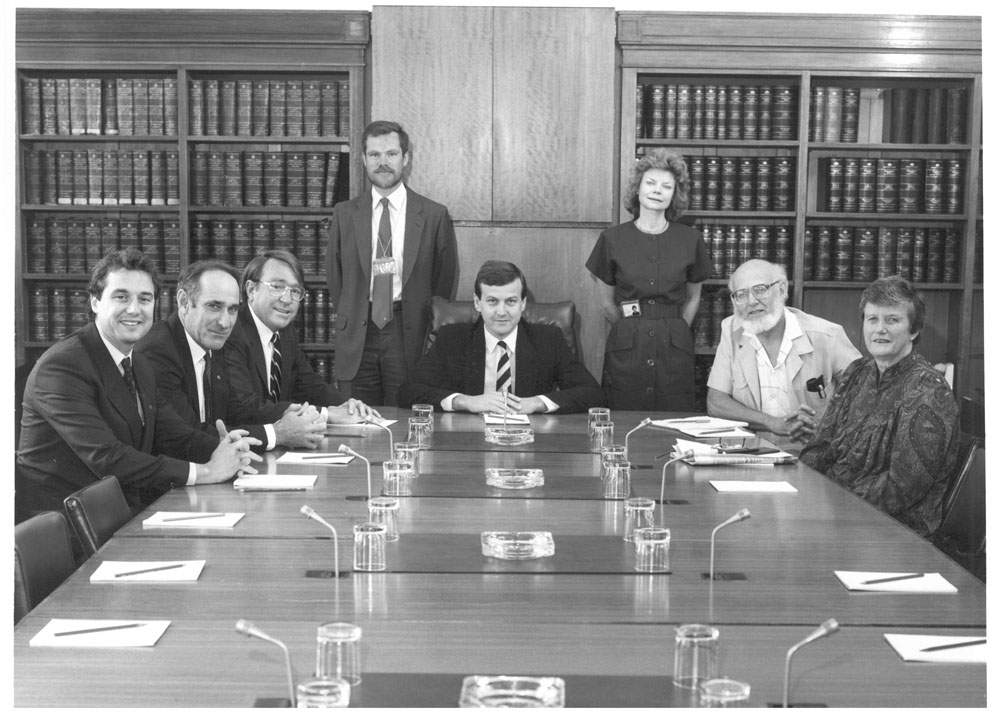 Standing Committee on Environment, Recreation and the Arts, December 1987. Standing L-R: Dr Les Rymer [Secretary] and Mary-Louise Willheim [Senior Research Officer]. Seated L-R: Senators Julian McGauran, John Panizza, Noel Chrichton-Browne [Deputy Chair], John Black [Chair], John Coulter and Olive Zakharov.