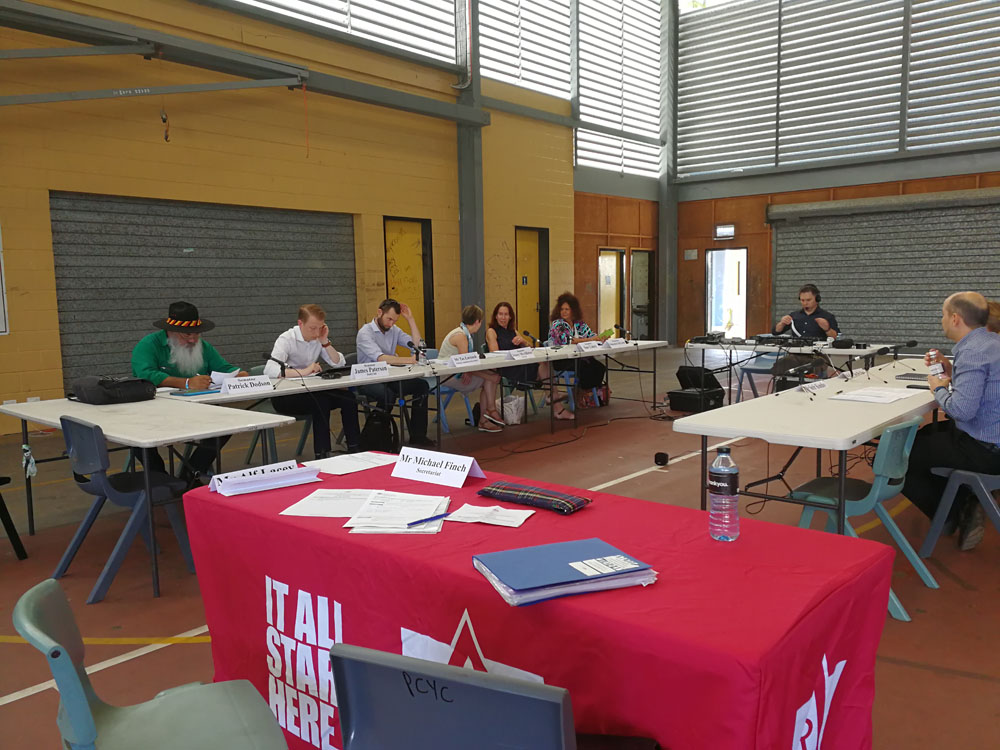 Committee members and employees from Campbell Page, the local Community Development Program provider on Palm Island, Queensland, at a public hearing held at the Police Citizens Youth Club, 4 October 2017. Seated on left facing camera L-R: Senators Patrick Dodson and James Paterson [Deputy Chair], Tasman Larnach [Acting Secretary], Senators Jenny McAllister [Chair], Sue Lines and Malarndirri McCarthy.