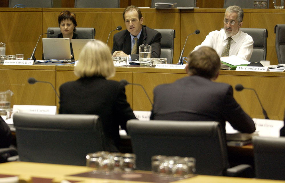 Members of the Legal and Constitutional Legislation Committee hearing evidence from officers from the Attorney-General's Department at a supplementary budget estimates hearing, 3 November 2003. Seated facing camera L-R: Senators Linda Kirk, Joe Ludwig and Nick Bolkus [Deputy Chair]. DPS Auspic. 