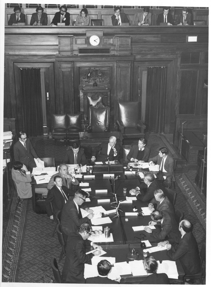 Select Committee on Securities and Exchange in the Senate Chamber of the Provisional Parliament House with members of the press gallery reporting on the committee in session, May 1971.