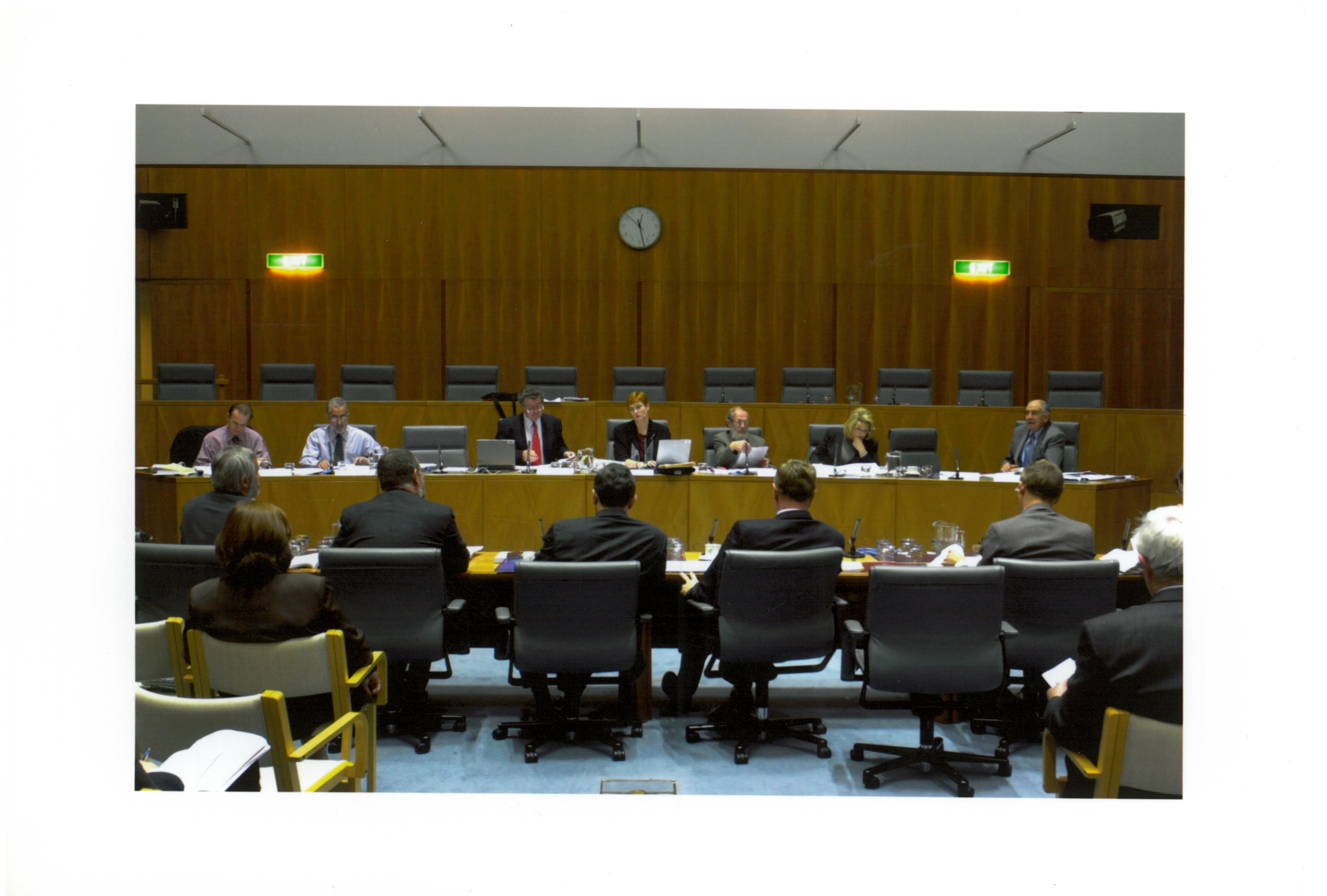 \x3cp\x3eMembers of the Senate Legal and Constitutional Legislation Committee at a budget estimates hearing, 28 May 2001. Seated facing camera L-R: Senators Joe Ludwig, Nick Bolkus, Jim McKiernan and Marise Payne [Chair], Noel Gregory [Secretary], Senators Helen Coonan and Barney Cooney.\x3c/p\x3e