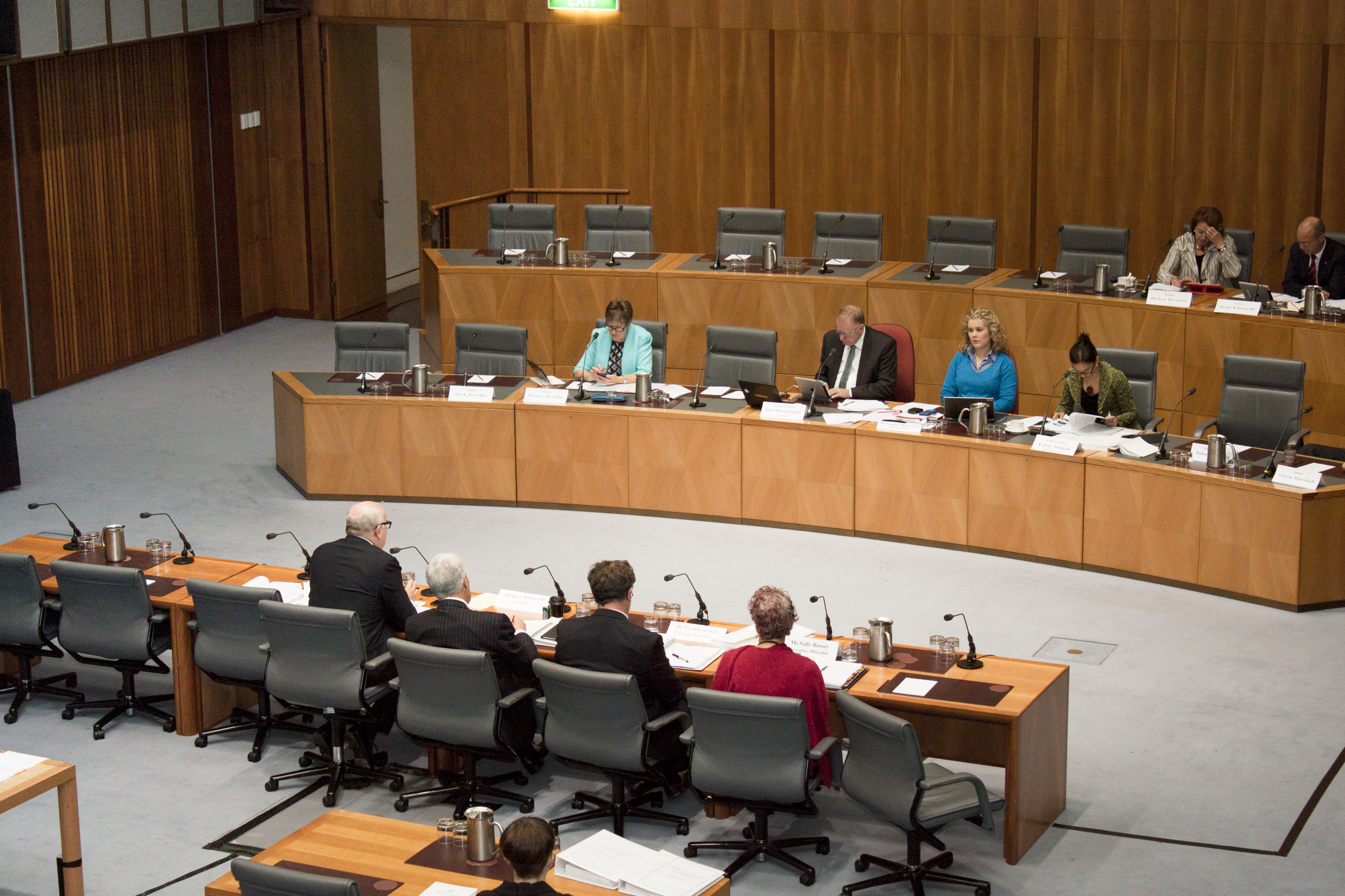 \x3cp\x3eCommittee members questioning Senator the Hon George Brandis, Attorney-General and Minister for the Arts, and departmental officers, 28 May 2014. Seated in top row L-R: Senators Helen Kroger and Sean Edwards. Seated in bottom row facing camera L-R: Senators Penny Wright and Ian Macdonald [Chair], Sophie Dunstone [Secretary] and Senator Lisa Singh [Deputy Chair]. \x3c/p\x3e