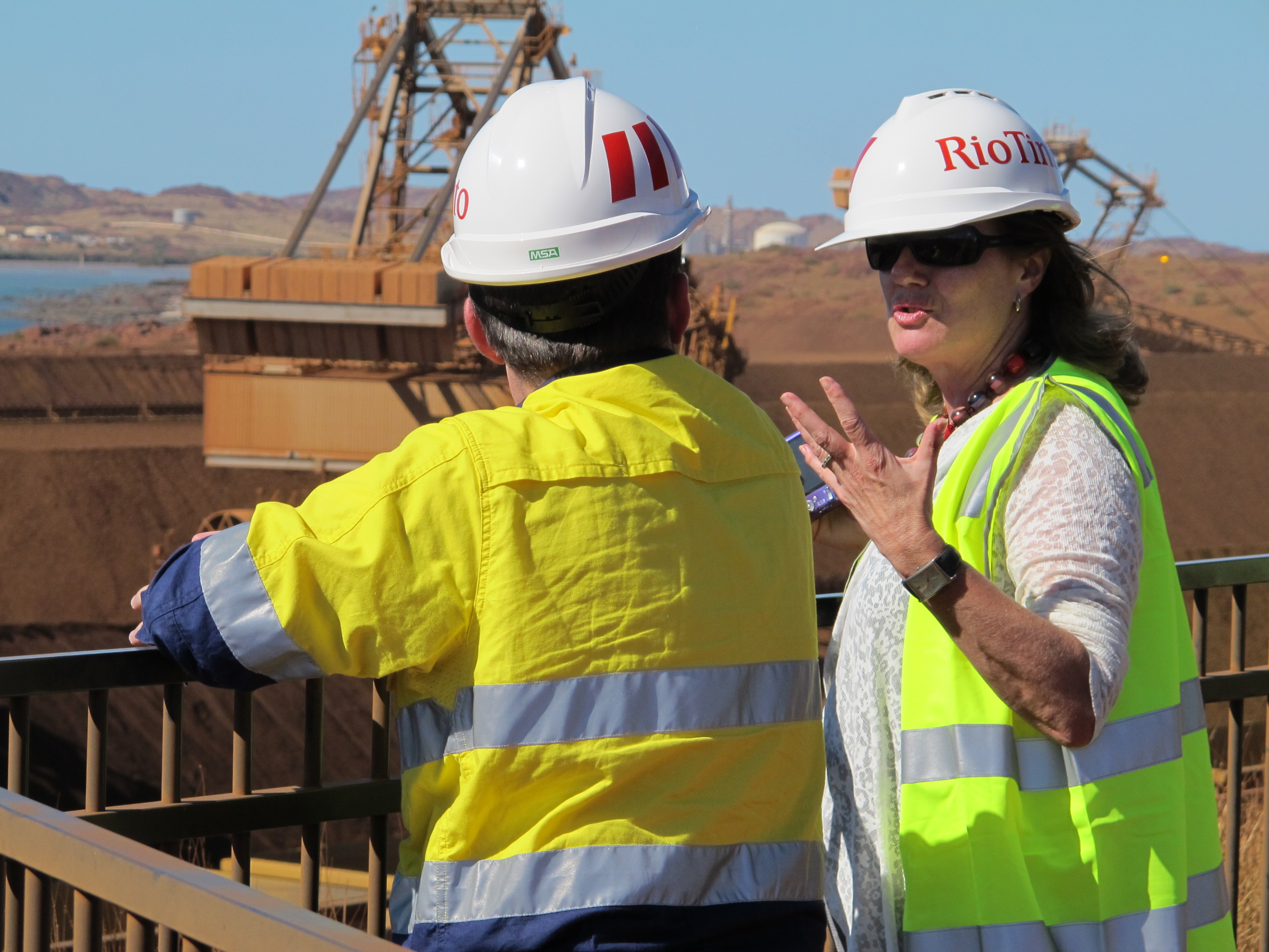 \x3cp\x3eCommittee member Senator Helen Kroger speaking with a Rio Tinto employee about the operations of its iron ore export site at Dampier Port, 23 April 2013.\x3c/p\x3e