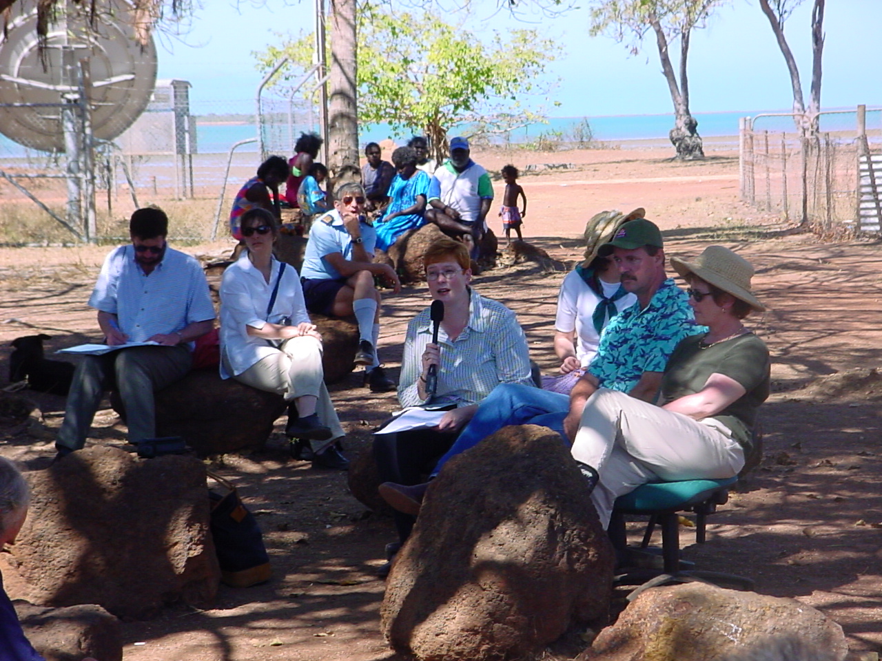 \x3cp\x3eActing committee chair Senator Marise Payne speaking to witnesses from the Warruwi and Minjilang communities at a  hearing on South Goulburn Island, NT, 11 September 2002. At right: L-R behind rock on right: Senators Ursula Stephens and Nigel Scullion.\x3c/p\x3e