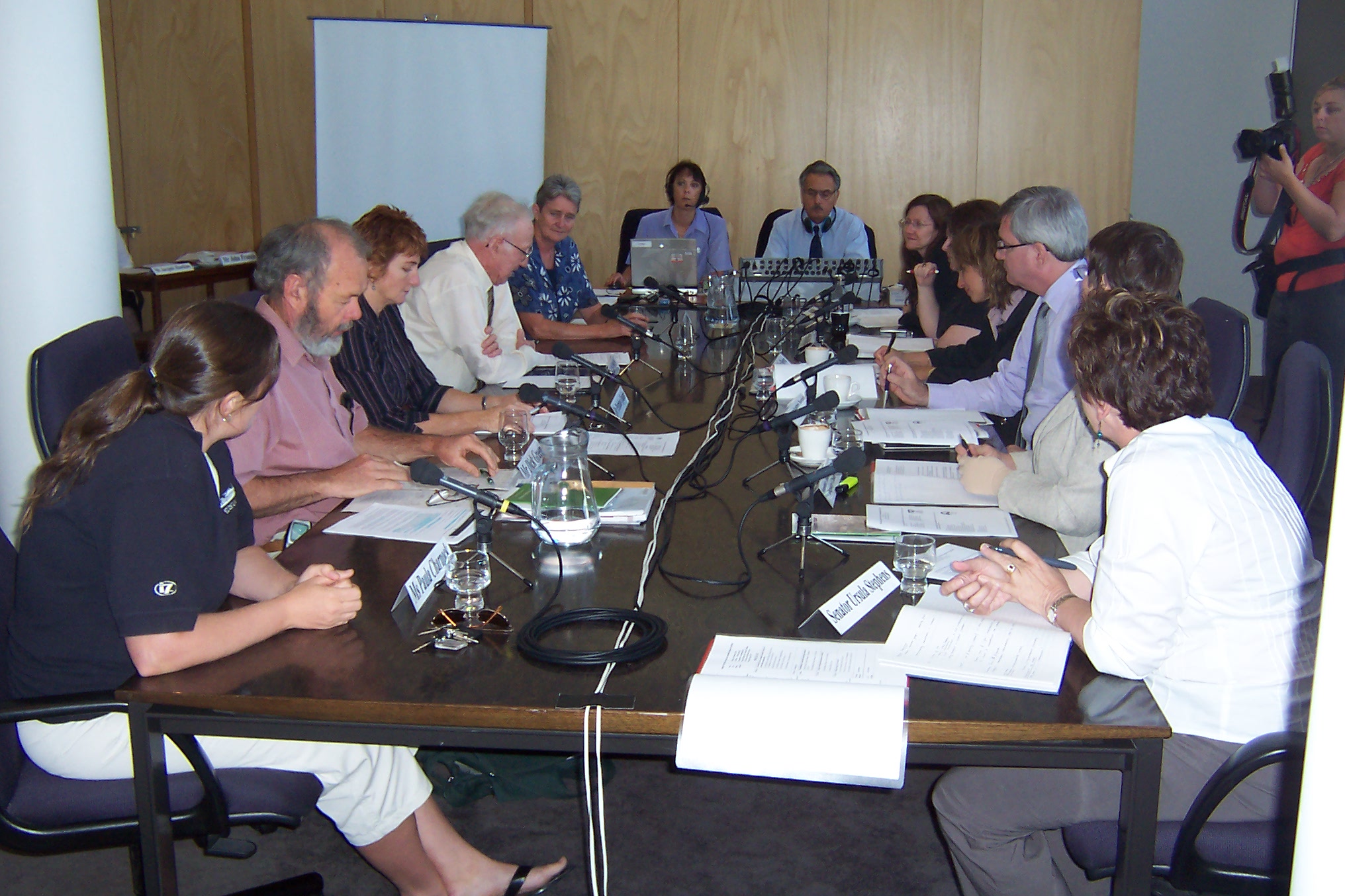 \x3cp\x3eCommittee hearing at Wagga Wagga, 10 February 2006. L-R: Paula Charnock [President, Wagga Wagga Urban Landcare], Dick Green [G0 Green Services], Dr Petrina Quinn [Central Riverina Landcare Network], James Phillips, Sister Carmel Wallis [Erin Earth], Hansard officer, Broadcasting officer, Senators Rachel Siewert and Ruth Webster, Jaquie Dewar [Committee Secretary], Senators Andrew Bartlett, Judith Adams and Ursula Stephens.\x3c/p\x3e