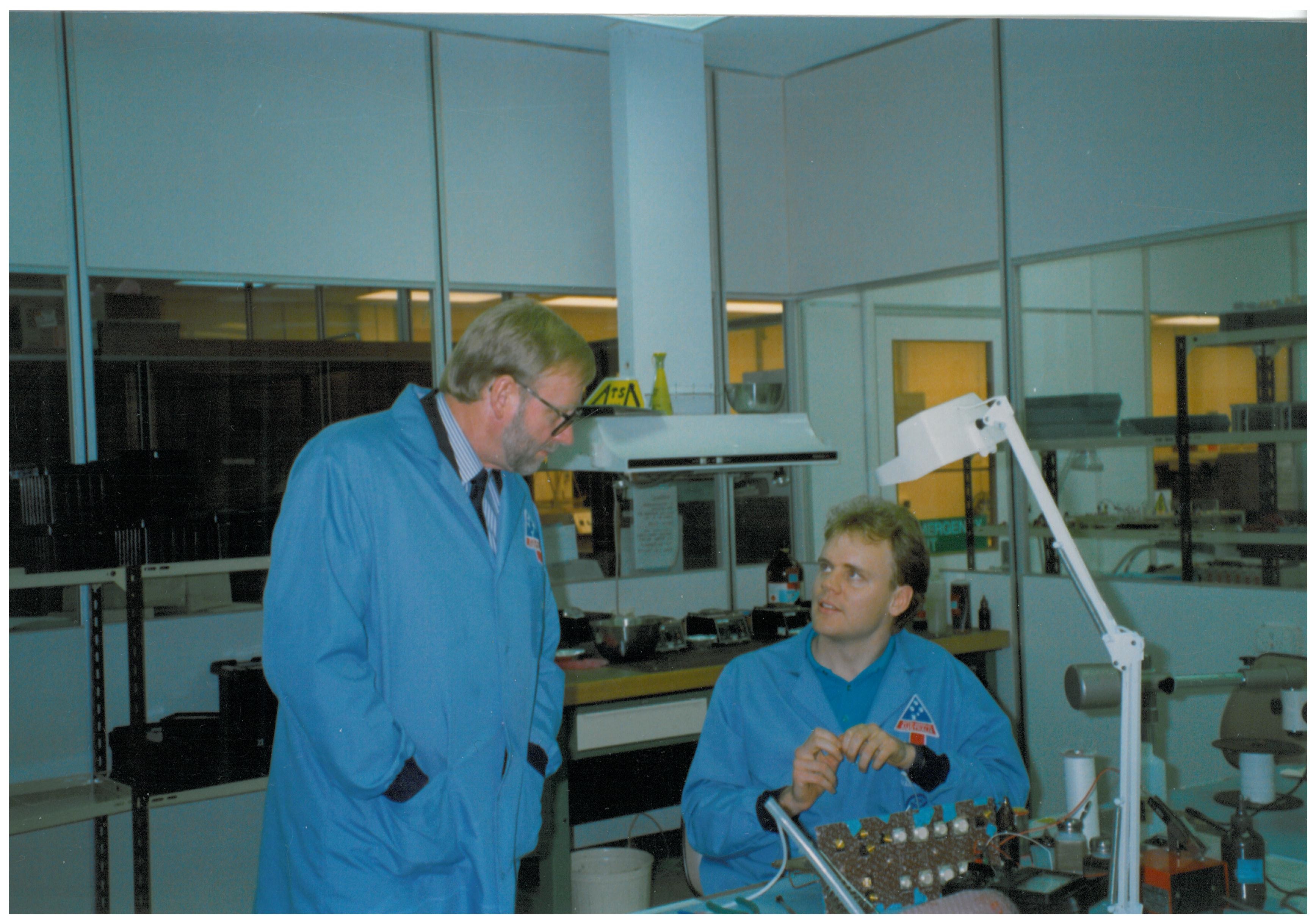 \x3cp\x3eCommittee member Senator Ian Macdonald observing the work of a British Aerospace Australia employee, British Aerospace Australia Space Manufacturing Facility, Salisbury, SA, 2 October 1991.\x3c/p\x3e